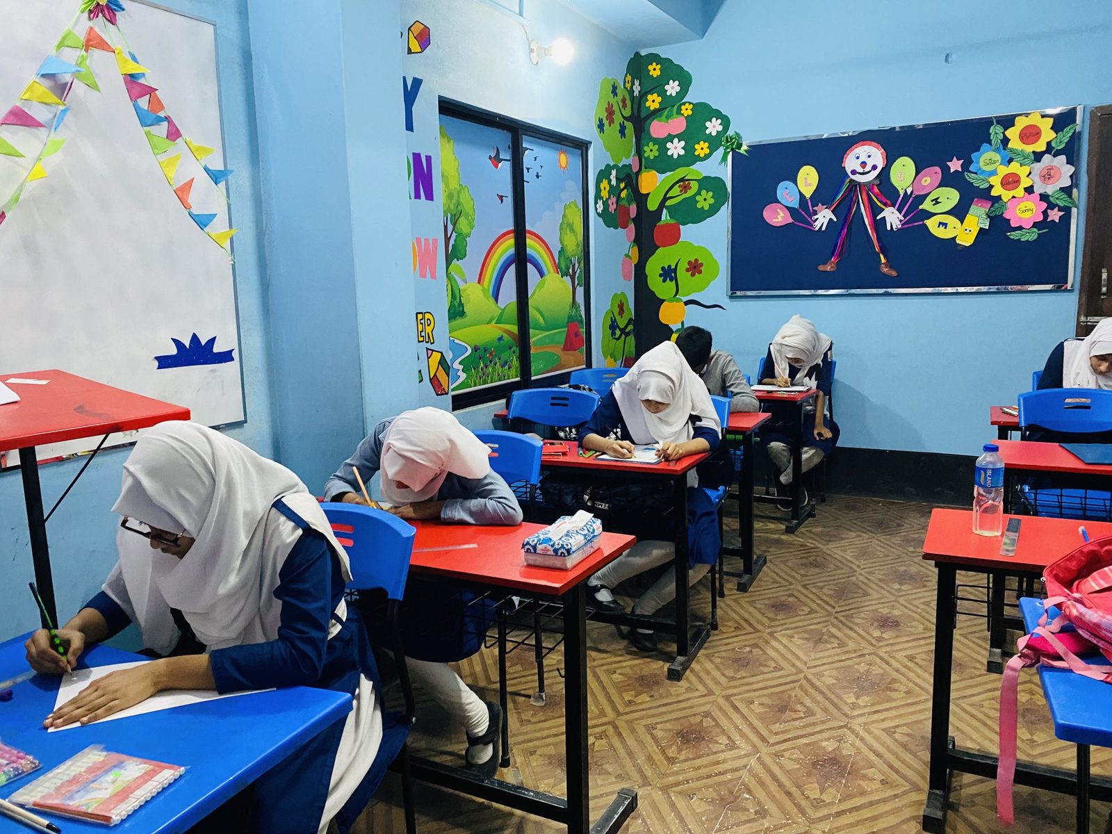 Students working in a colourful Genesis classroom